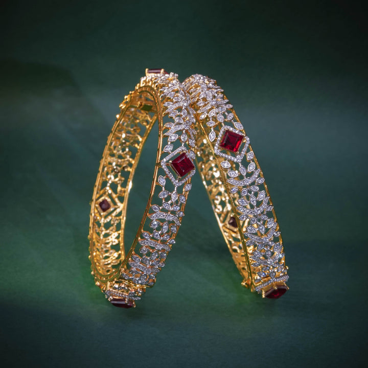 92.5 silver CZ bangles with floral motifs, and semi-precious ruby stones by Sri Fine Jewellery, Hyderabad.
(https://www.srifinejewellery.com)