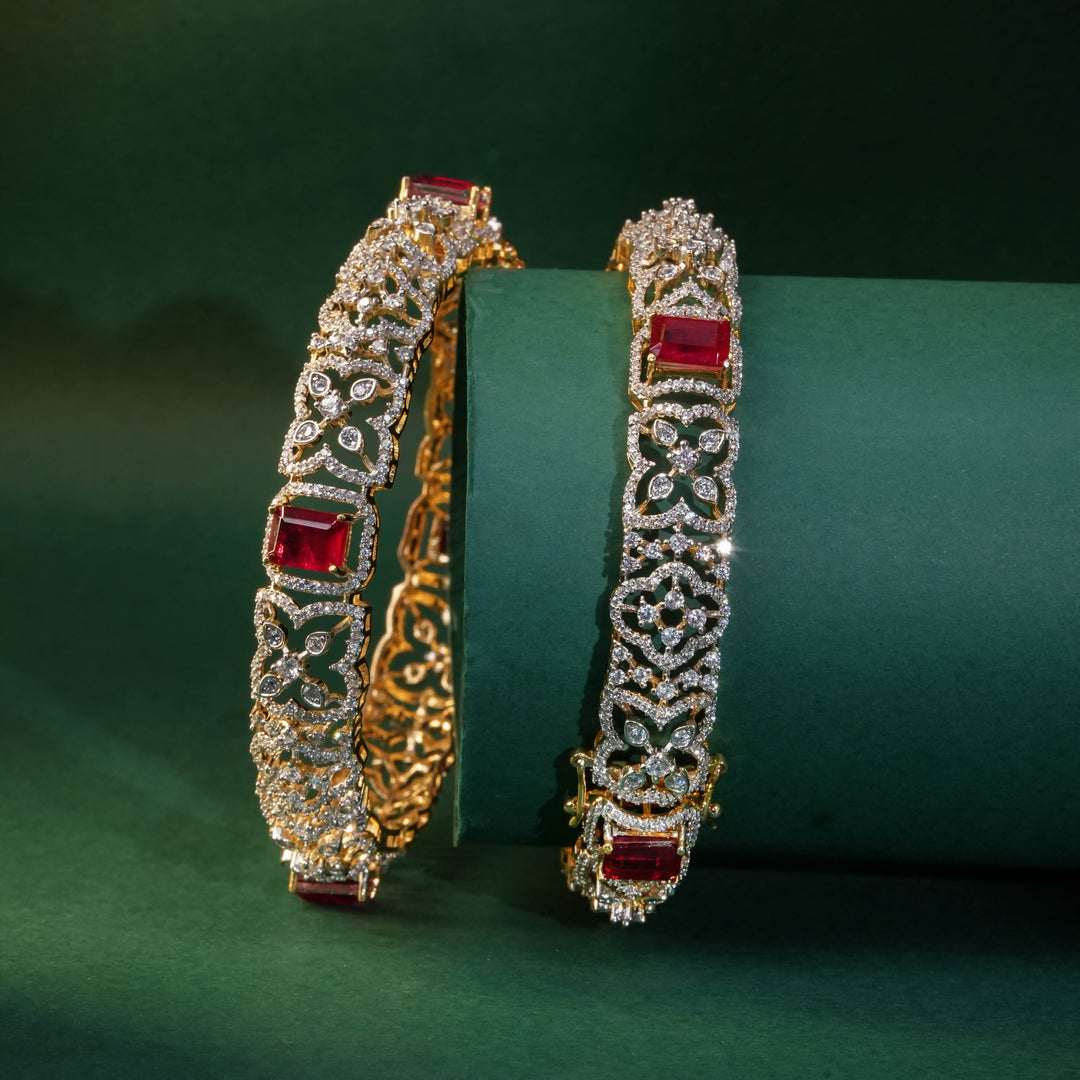 92.5 silver CZ bangles with floral motifs, and semi-precious ruby stones by Sri Fine Jewellery, Hyderabad.
(https://www.srifinejewellery.com)