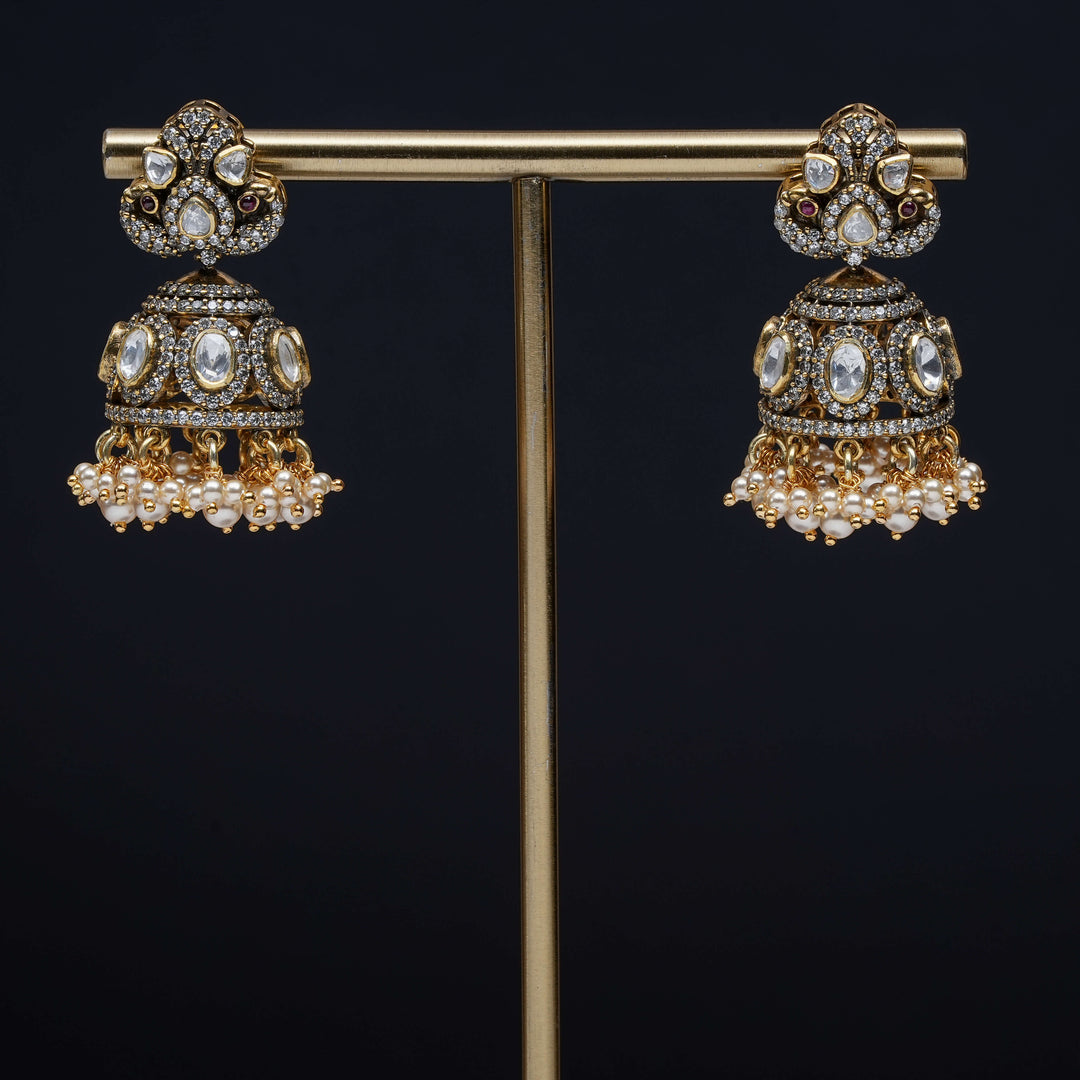 Premium 92.5 silver moissanite jhumka earrings with pearl drops, antique finish, and intricate handcrafted detailing by Sri Fine Jewellery, Hyderabad
(https://www.srifinejewellery.com)