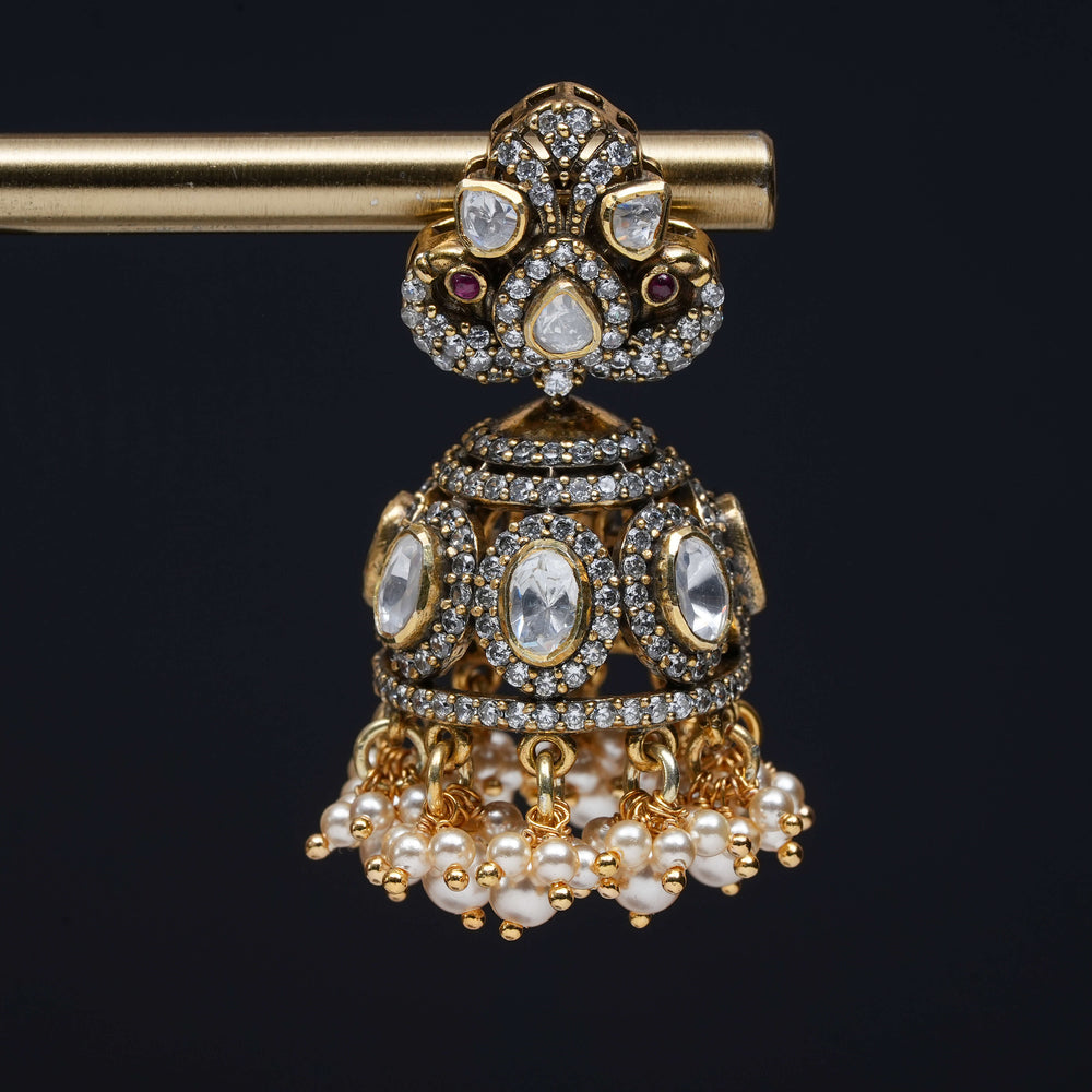 Premium 92.5 silver moissanite jhumka earrings with pearl drops, antique finish, and intricate handcrafted detailing by Sri Fine Jewellery, Hyderabad
(https://www.srifinejewellery.com)
