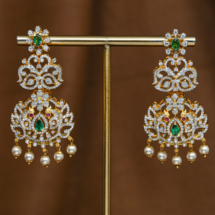 Full view of premium 92.5 silver cz emerald earrings with peacock design and pearl drops by Sri Fine Jewellery, Hyderabad (https://srifinejewellery.com)