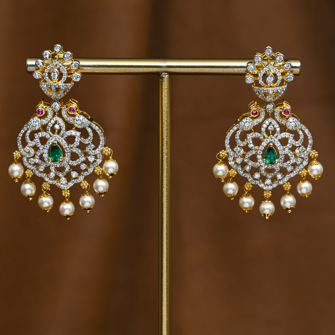Full view of premium 92.5 silver cz emerald earrings with peacock design and pearl drops by Sri Fine Jewellery, Hyderabad (https://srifinejewellery.com)