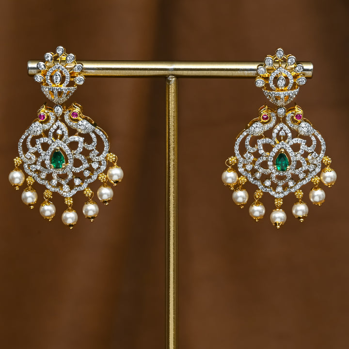Full view of premium 92.5 silver cz emerald earrings with peacock design and pearl drops by Sri Fine Jewellery, Hyderabad (https://srifinejewellery.com)