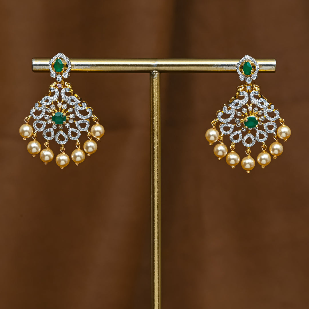 Full view of premium 92.5 silver cz emerald earrings with intricate peacock design detailing and pearl drops by Sri Fine Jewellery, Hyderabad (https://srifinejewellery.com)