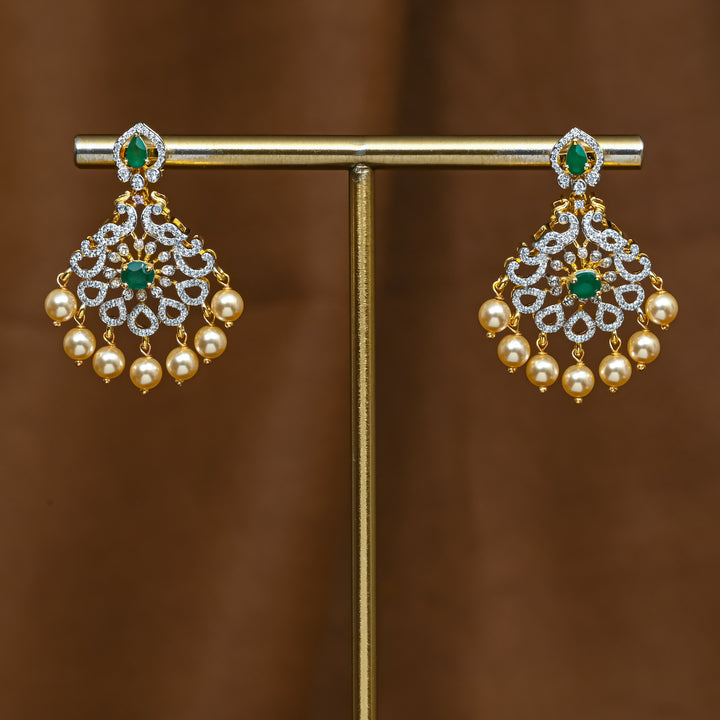 Full view of premium 92.5 silver cz emerald earrings with intricate peacock design detailing and pearl drops by Sri Fine Jewellery, Hyderabad (https://srifinejewellery.com)