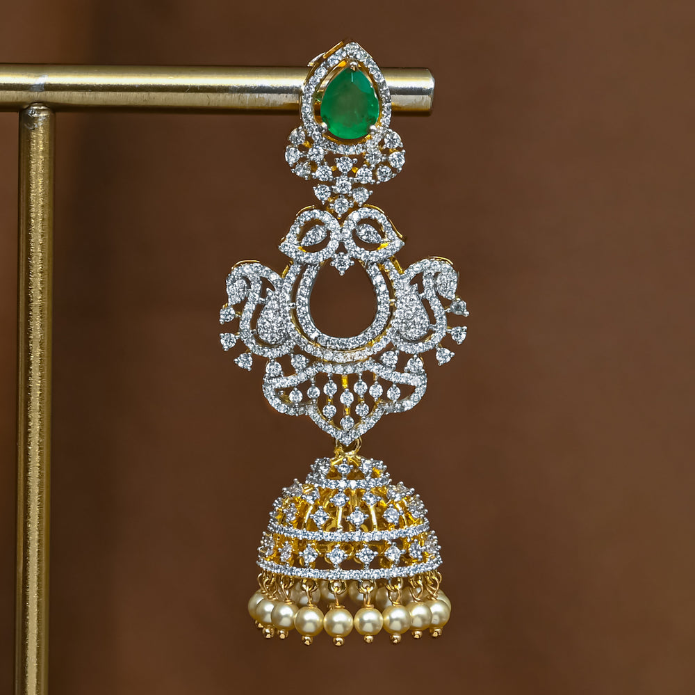 Close-up view of premium 92.5 silver cz emerald jhumka earrings with intricate detailing and pearl drops by Sri Fine Jewellery, Hyderabad (https://srifinejewellery.com)
