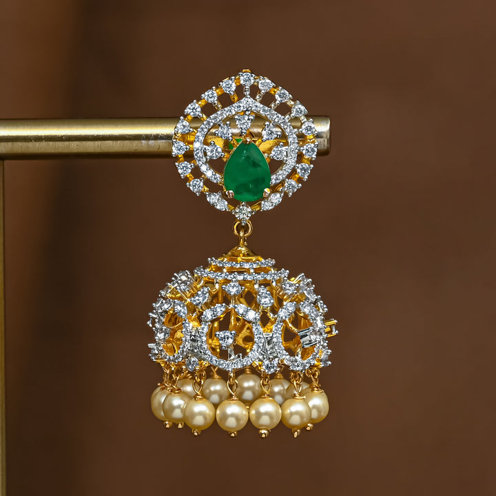 Close-up view of premium 92.5 silver cz emerald jhumka earrings with intricate detailing and pearl drops by Sri Fine Jewellery, Hyderabad (https://srifinejewellery.com)