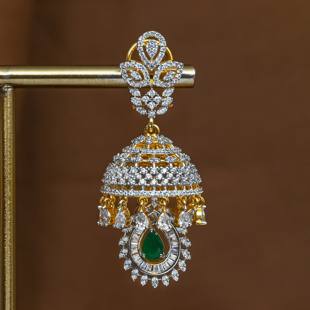 Close-up view of premium 92.5 silver cz emerald jhumka earrings with intricate detailing by Sri Fine Jewellery, Hyderabad (https://srifinejewellery.com)