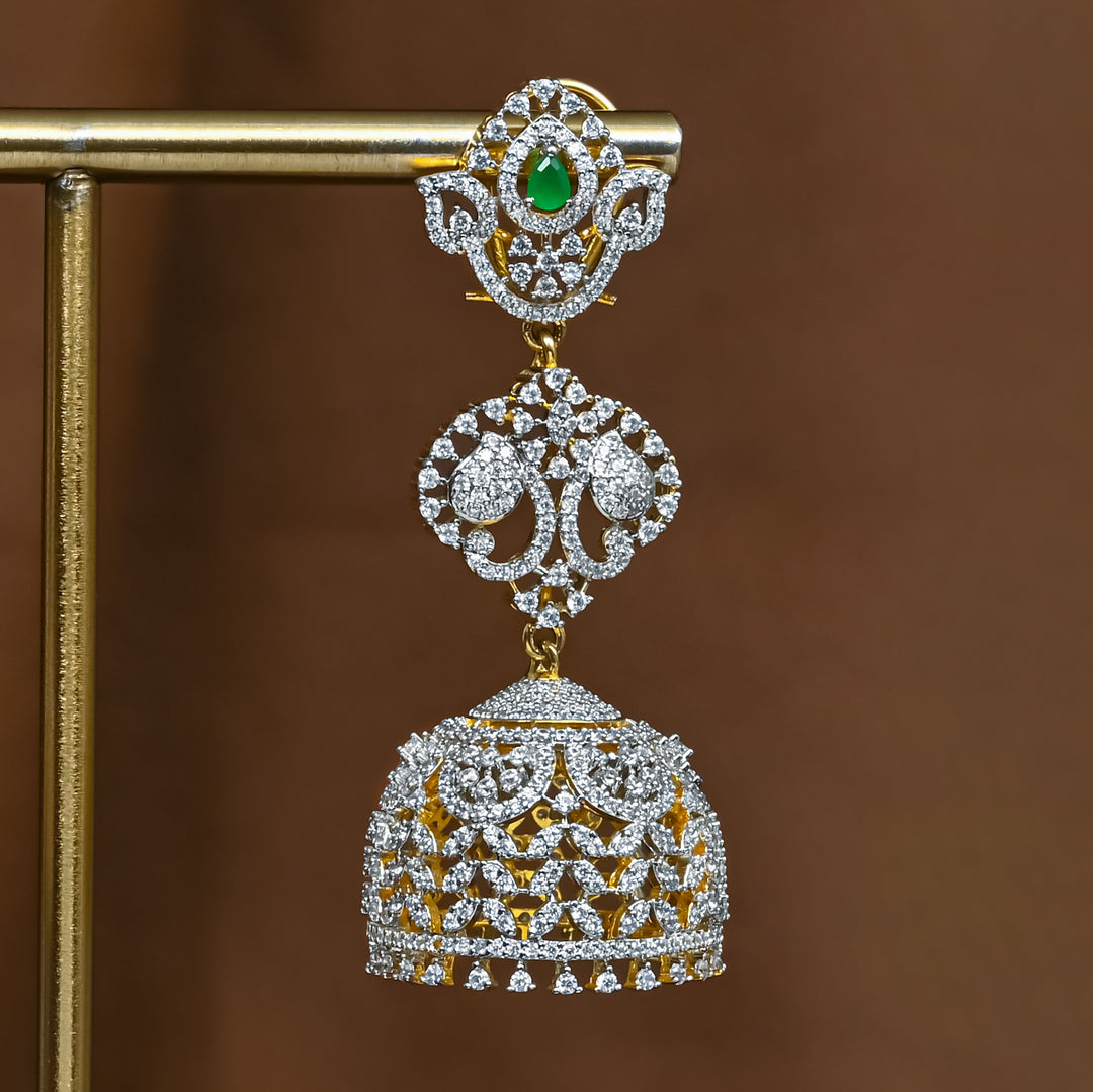 Close-up view of premium 92.5 silver cz emerald jhumka earrings with intricate detailing by Sri Fine Jewellery, Hyderabad (https://srifinejewellery.com)