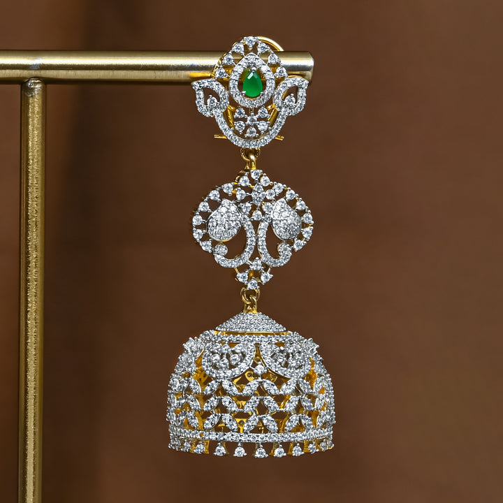 Close-up view of premium 92.5 silver cz emerald jhumka earrings with intricate detailing by Sri Fine Jewellery, Hyderabad (https://srifinejewellery.com)