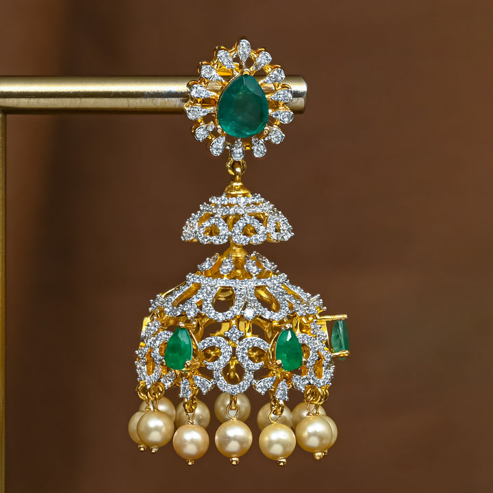 Close-up view of premium 92.5 silver cz emerald jhumka earrings with intricate detailing and pearl drops by Sri Fine Jewellery, Hyderabad (https://srifinejewellery.com)