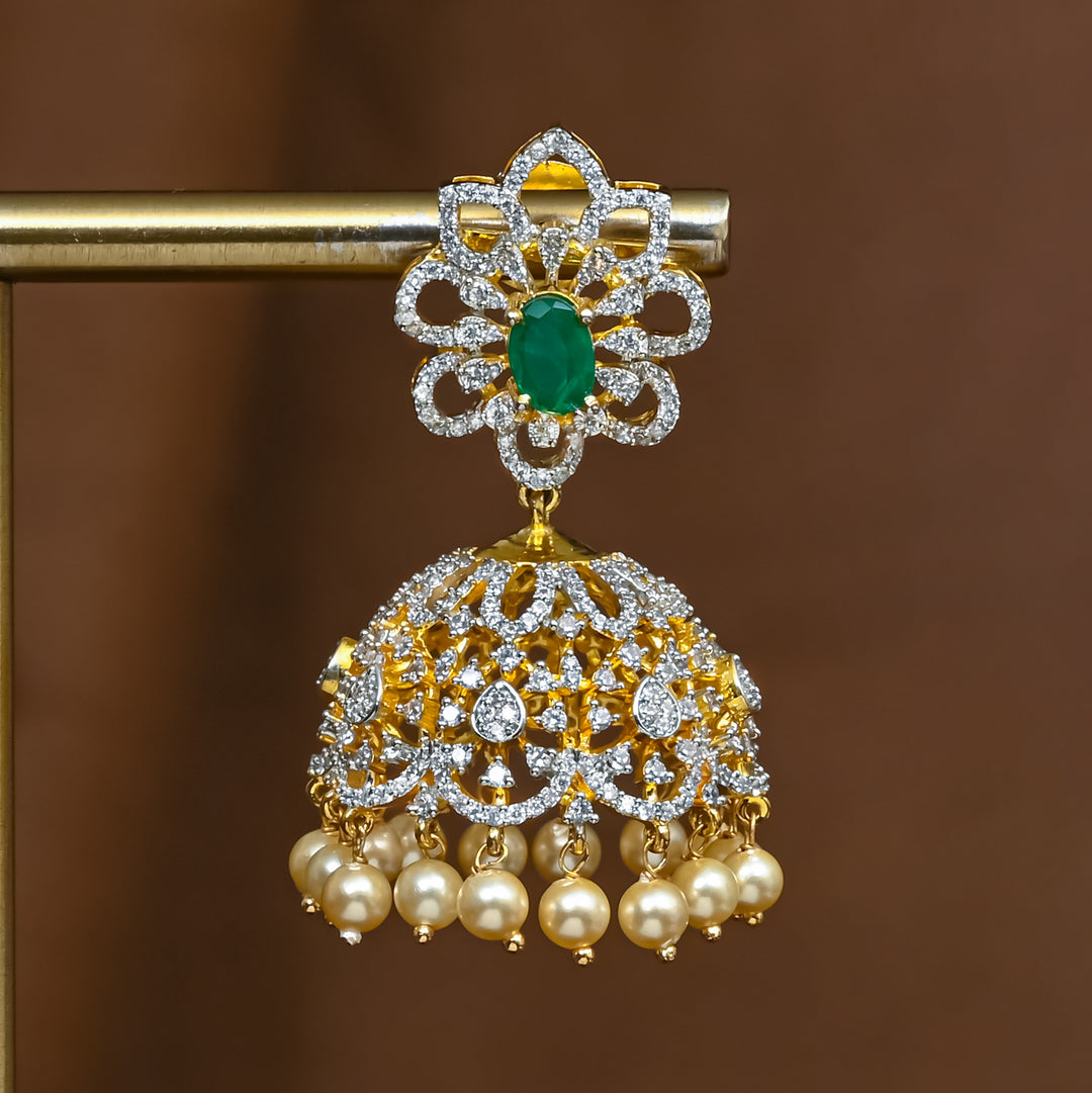 Close-up view of premium 92.5 silver cz emerald jhumka earrings with intricate detailing and pearl drops by Sri Fine Jewellery, Hyderabad (https://srifinejewellery.com)