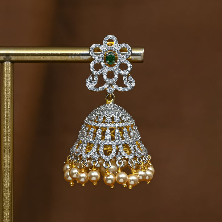 Close-up view of premium 92.5 silver cz emerald jhumka earrings with intricate detailing and pearl drops by Sri Fine Jewellery, Hyderabad (https://srifinejewellery.com)