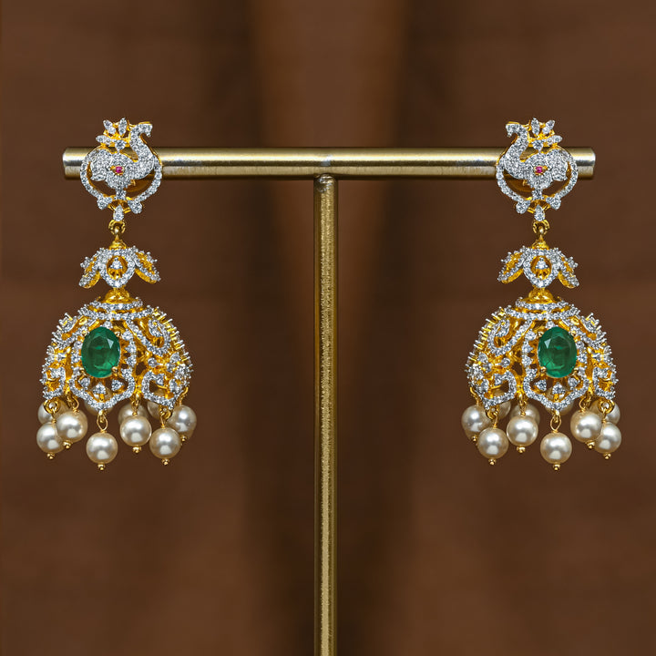 Full view of premium 92.5 silver cz emerald jhumka earrings with intricate detailing and pearl drops by Sri Fine Jewellery, Hyderabad (https://srifinejewellery.com)