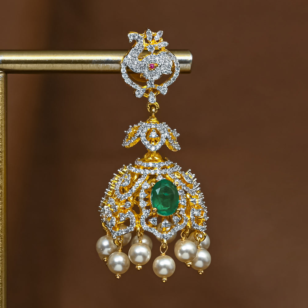 Close-up view of premium 92.5 silver cz emerald jhumka earrings with intricate detailing and pearl drops by Sri Fine Jewellery, Hyderabad (https://srifinejewellery.com)