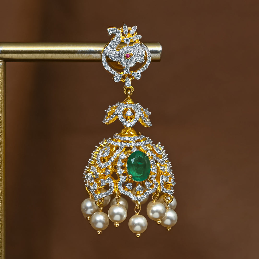 Close-up view of premium 92.5 silver cz emerald jhumka earrings with intricate detailing and pearl drops by Sri Fine Jewellery, Hyderabad (https://srifinejewellery.com)