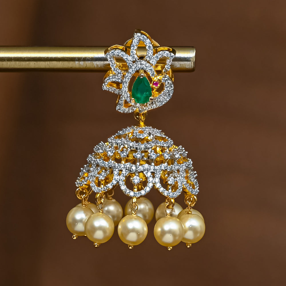 Close-up view of premium 92.5 silver cz emerald jhumka earrings with intricate peacock detailing and pearl drops by Sri Fine Jewellery, Hyderabad (https://srifinejewellery.com)