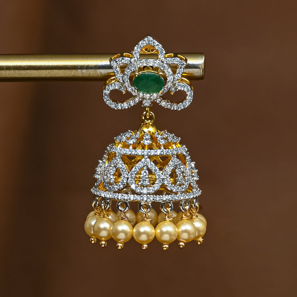 Close-up view of premium 92.5 silver cz emerald jhumka earrings with intricate detailing and pearl drops by Sri Fine Jewellery, Hyderabad 