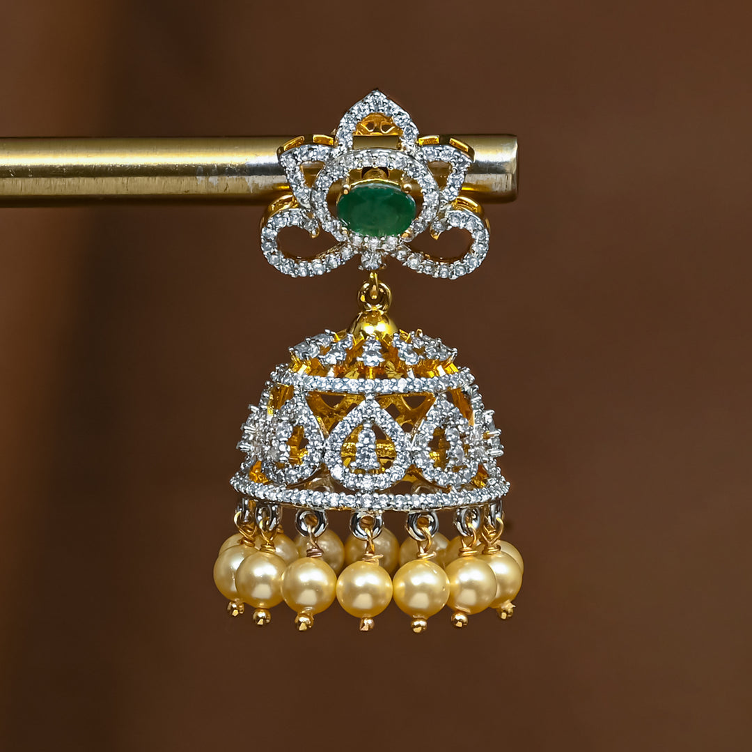 Close-up view of premium 92.5 silver cz emerald jhumka earrings with intricate detailing and pearl drops by Sri Fine Jewellery, Hyderabad 