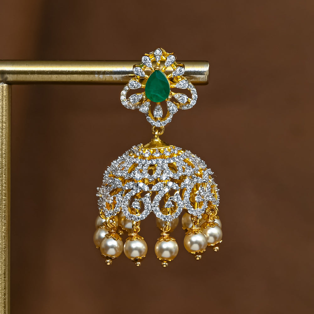 Close-up of premium 92.5 silver cz emerald jhumka earrings with intricate detailing and pearl drops by Sri Fine Jewellery, Hyderabad 