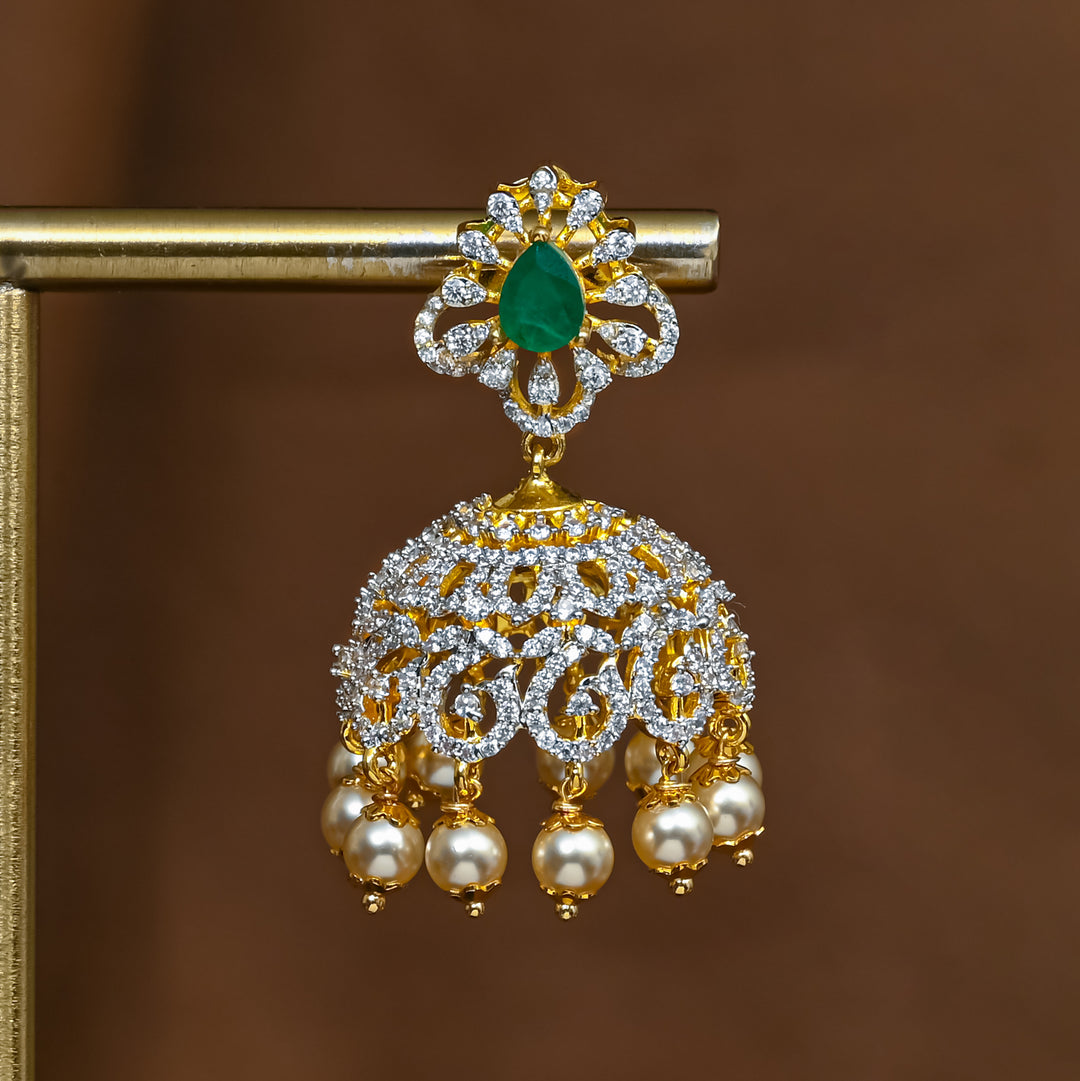 Close-up of premium 92.5 silver cz emerald jhumka earrings with intricate detailing and pearl drops by Sri Fine Jewellery, Hyderabad 