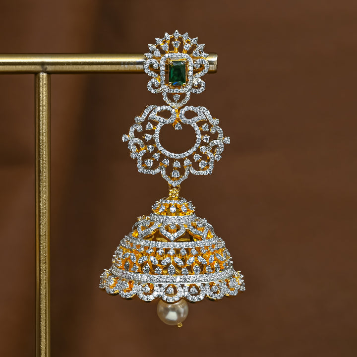 Close-up of premium 92.5 silver cz emerald jhumka earrings with intricate peacock detailing and pearl drops by Sri Fine Jewellery, Hyderabad 