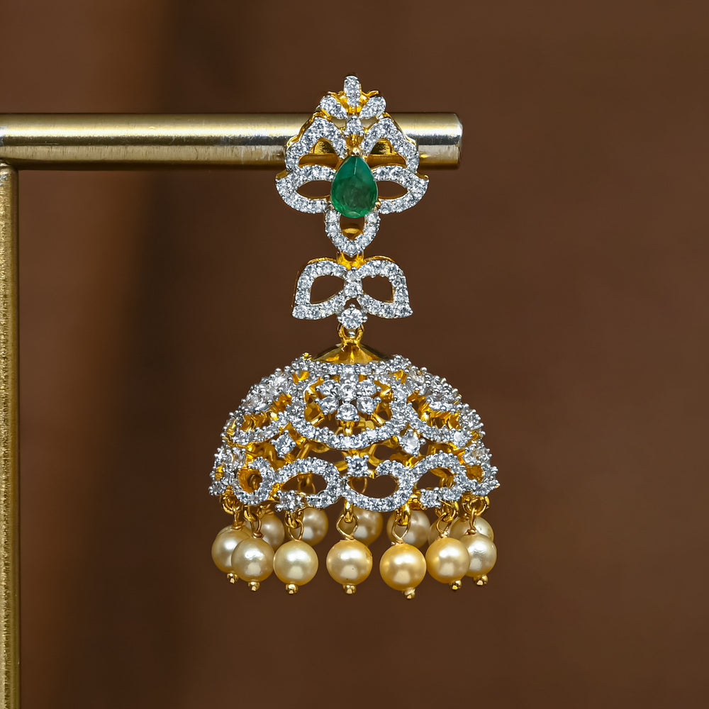 Close-up of premium 92.5 silver cz emerald jhumka earrings with intricate detailing and pearl drops by Sri Fine Jewellery, Hyderabad (https://srifinejewellery.com)