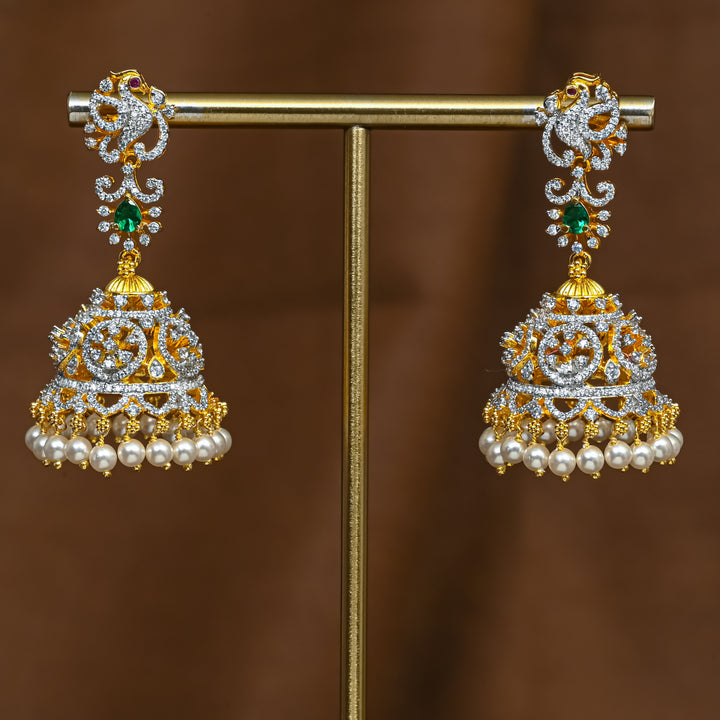 Full view of premium 92.5 silver cz emerald jhumka earrings with intricate peacock detailing and pearl drops by Sri Fine Jewellery, Hyderabad (https://srifinejewellery.com)
