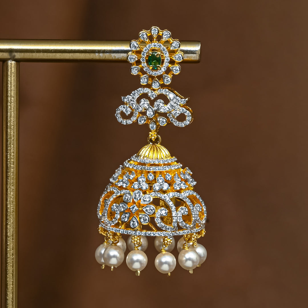 Close-up of premium 92.5 silver cz emerald jhumka earrings with intricate detailing and pearl drops by Sri Fine Jewellery, Hyderabad (https://srifinejewellery.com)