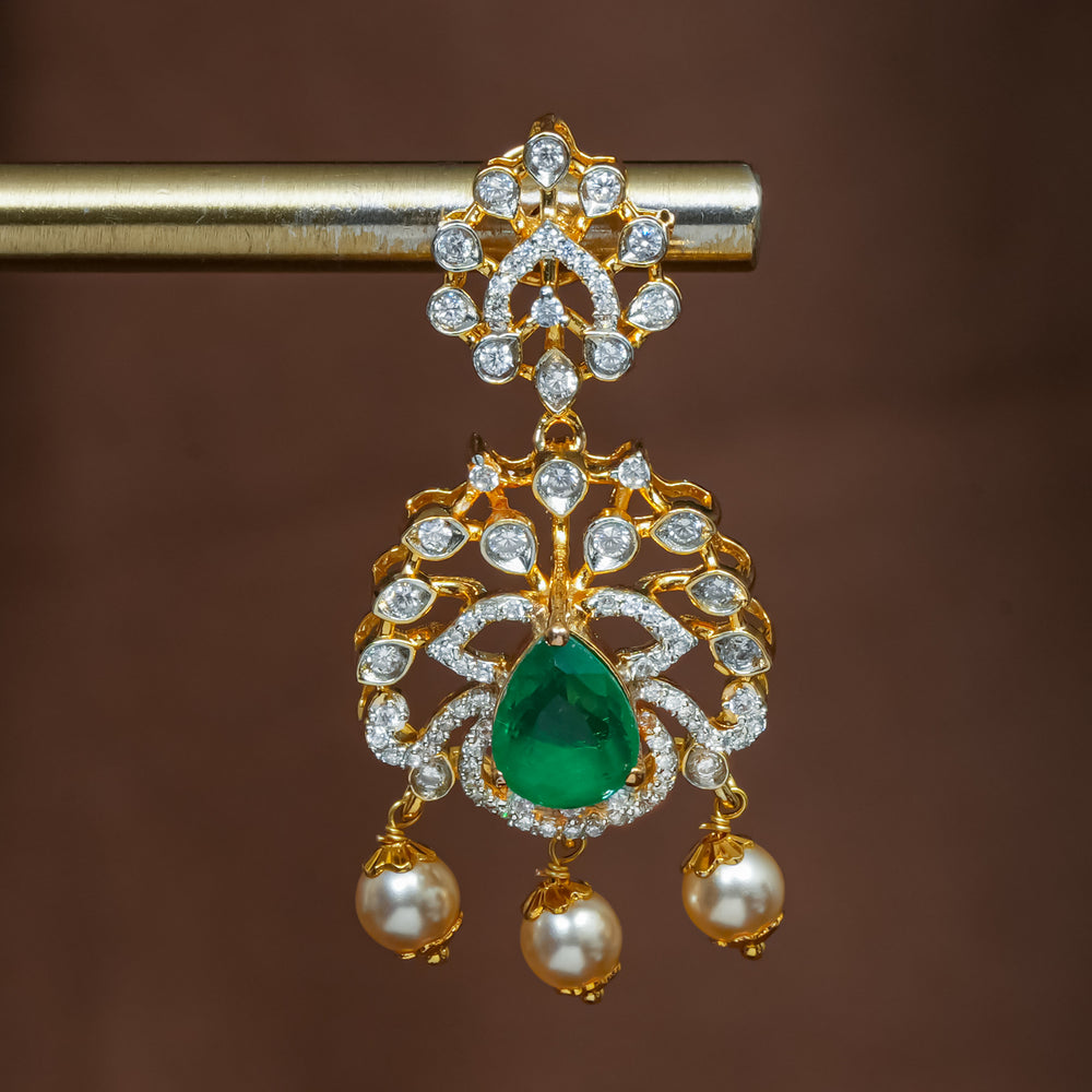Close-up view of premium 92.5 silver cz emerald earrings with intricate detailing and pearl drops by Sri Fine Jewellery, Hyderabad (https://srifinejewellery.com)