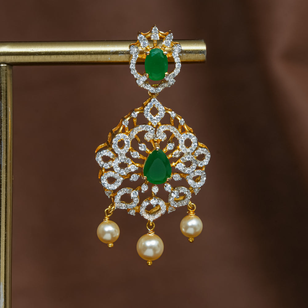 Close-up view of premium 92.5 silver cz emerald earrings with intricate detailing and pearl drops by Sri Fine Jewellery, Hyderabad (https://srifinejewellery.com)