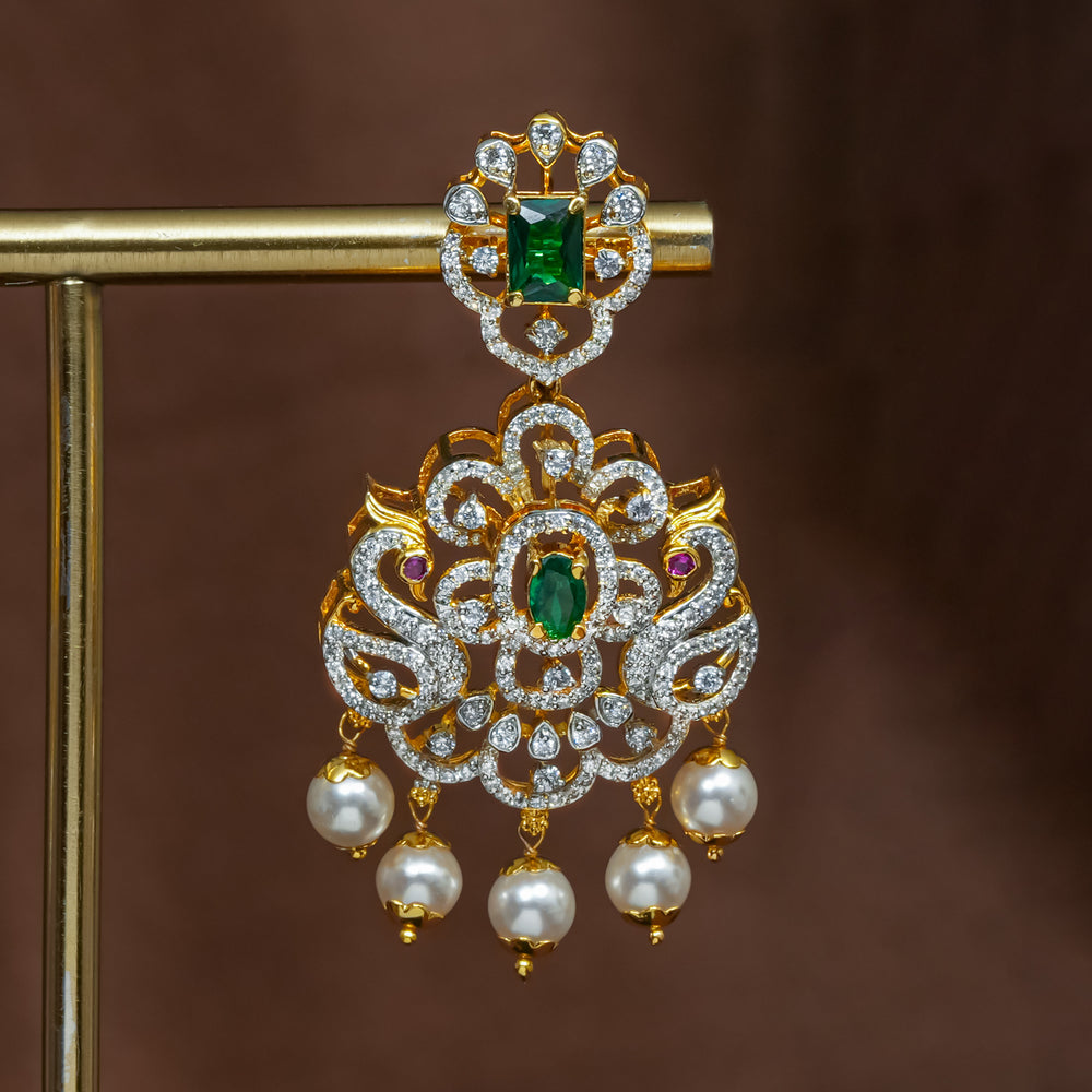 Close-up view of premium 92.5 silver cz emerald earrings with intricate peacock design detailing and pearl drops by Sri Fine Jewellery, Hyderabad (https://srifinejewellery.com)