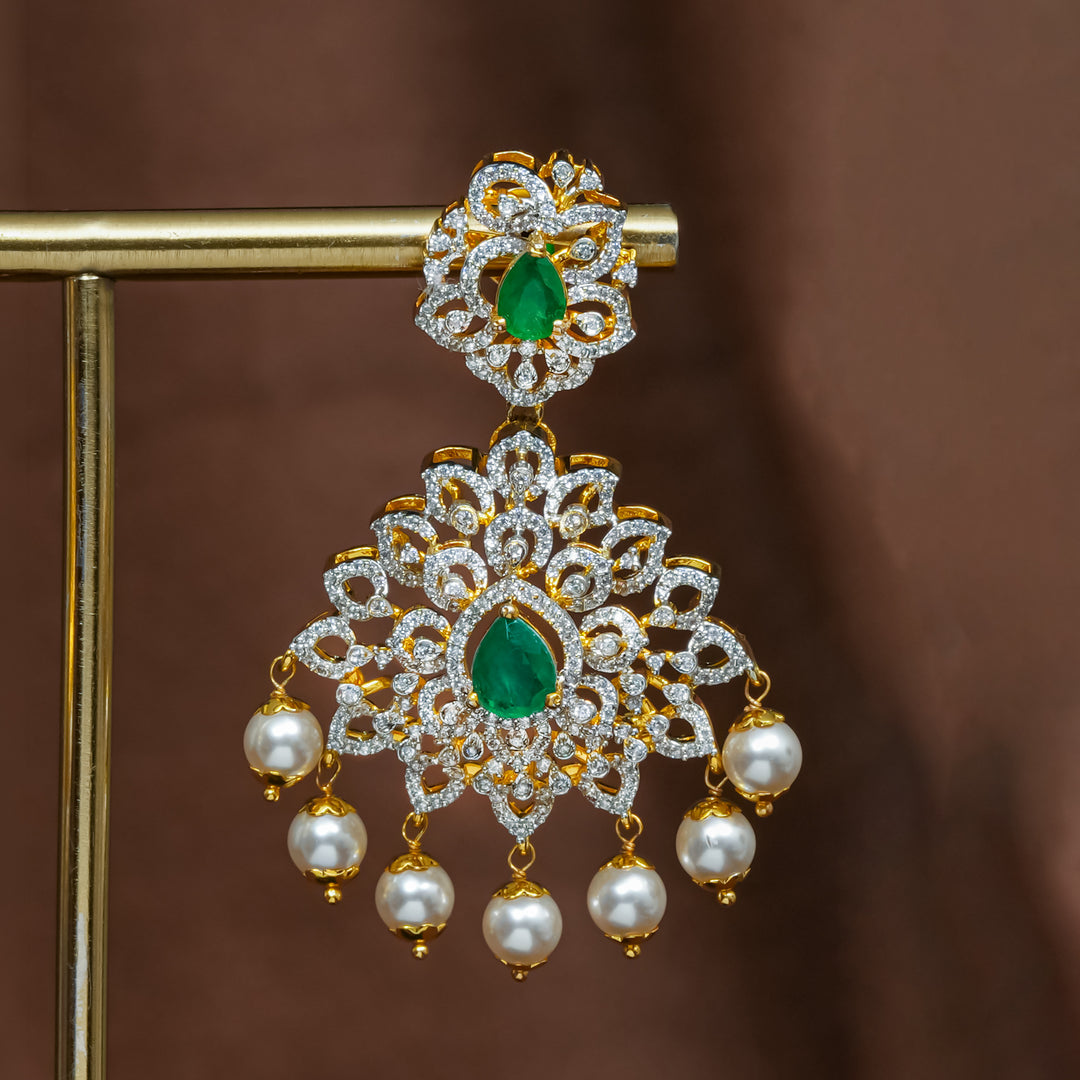 Close-upview of premium 92.5 silver cz emerald earrings with intricate detailing and pearl drops by Sri Fine Jewellery, Hyderabad (https://srifinejewellery.com)