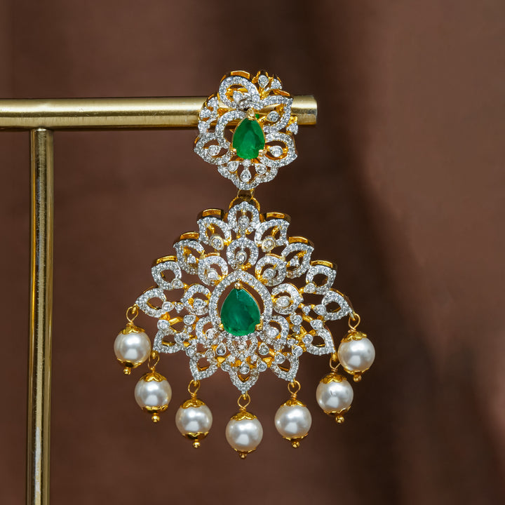 Close-upview of premium 92.5 silver cz emerald earrings with intricate detailing and pearl drops by Sri Fine Jewellery, Hyderabad (https://srifinejewellery.com)