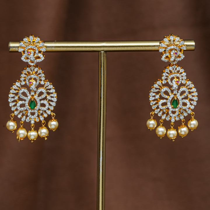 Full view of premium 92.5 silver cz emerald earrings with intricate peacock detailing and pearl drops by Sri Fine Jewellery, Hyderabad (https://srifinejewellery.com)