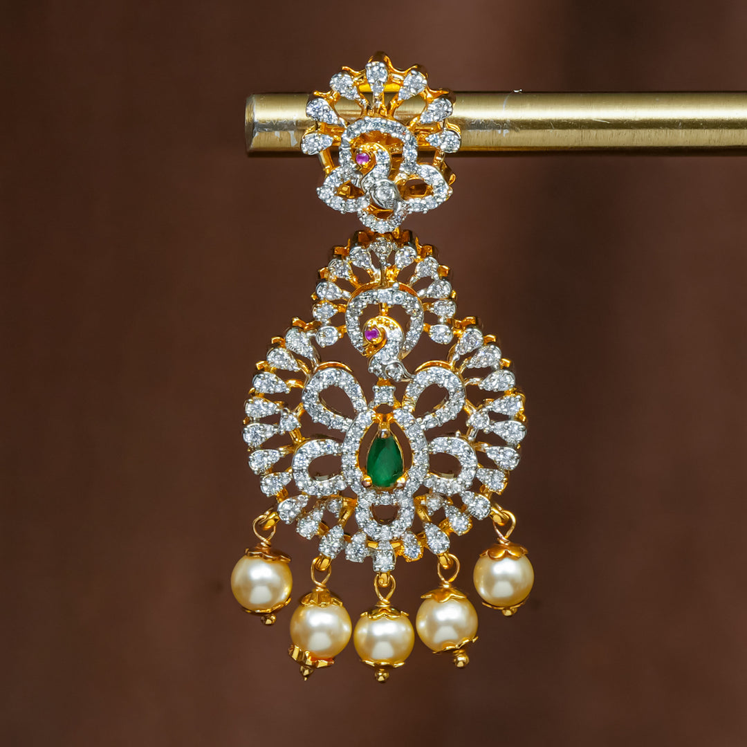 Close-up view of premium 92.5 silver cz emerald earrings with intricate peacock design detailing and pearl drops by Sri Fine Jewellery, Hyderabad (https://srifinejewellery.com)