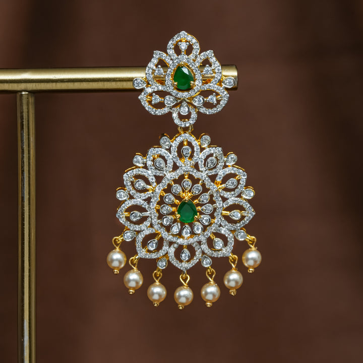 Close-up view of premium 92.5 silver cz emerald earrings with intricate detailing and pearl drops by Sri Fine Jewellery, Hyderabad (https://srifinejewellery.com)