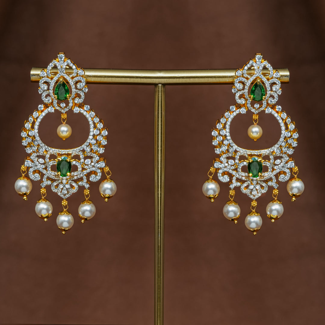 Full view of premium 92.5 silver cz emerald chandbali earrings with intricate detailing and pearl drops by Sri Fine Jewellery, Hyderabad (https://srifinejewellery.com)
