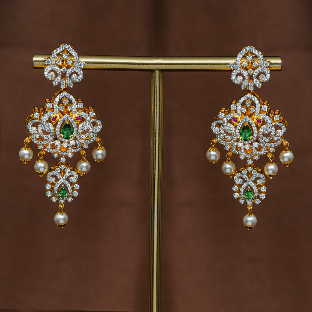 Full view of premium 92.5 silver cz emerald earrings with intricate peacock design detailing and pearl drops by Sri Fine Jewellery, Hyderabad (https://srifinejewellery.com)