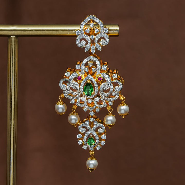Close-up view of premium 92.5 silver cz emerald earrings with intricate peacock design detailing and pearl drops by Sri Fine Jewellery, Hyderabad (https://srifinejewellery.com)