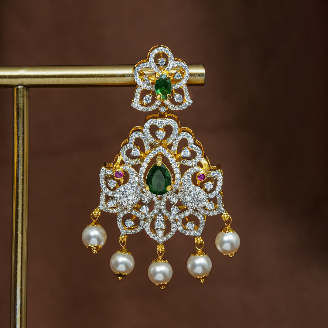 Close-up view of premium 92.5 silver cz emerald earrings with intricate peacock design detailing and pearl drops by Sri Fine Jewellery, Hyderabad (https://srifinejewellery.com)