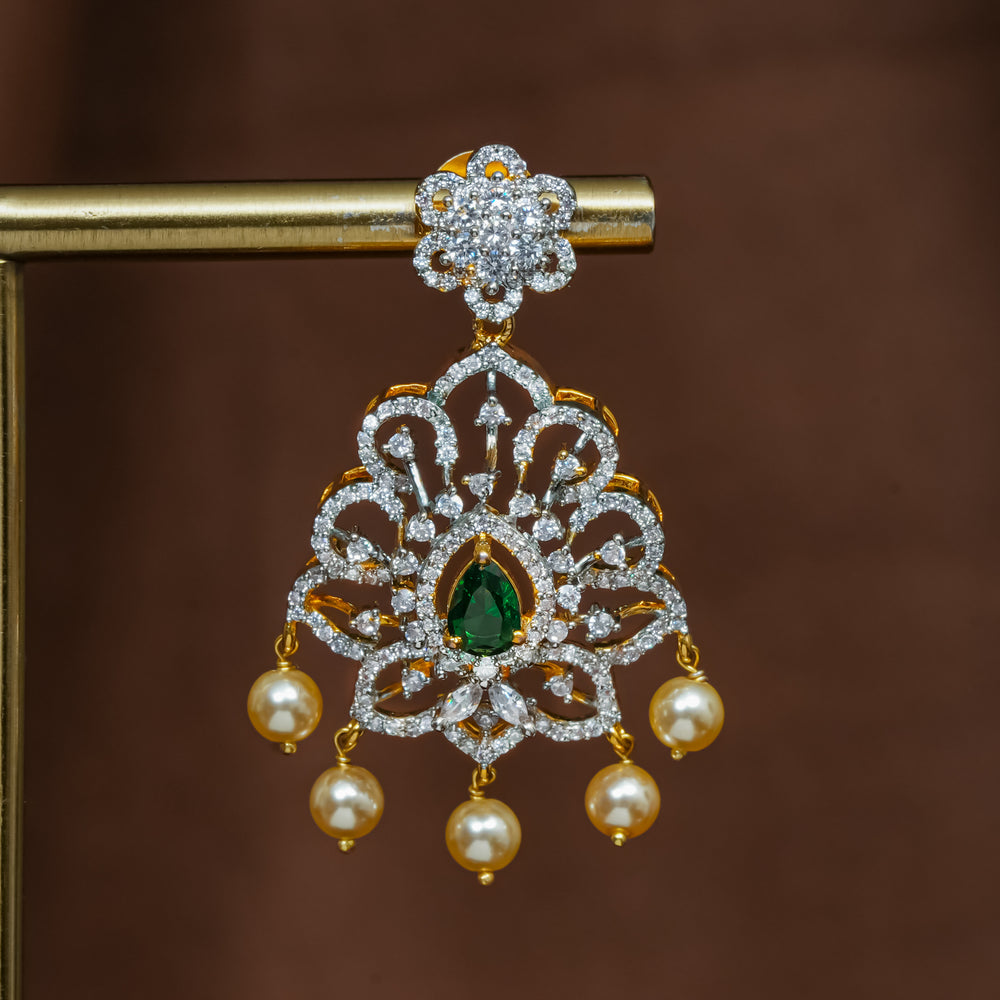 Close-up view of premium 92.5 silver cz emerald earrings with intricate detailing and pearl drops by Sri Fine Jewellery, Hyderabad (https://srifinejewellery.com)