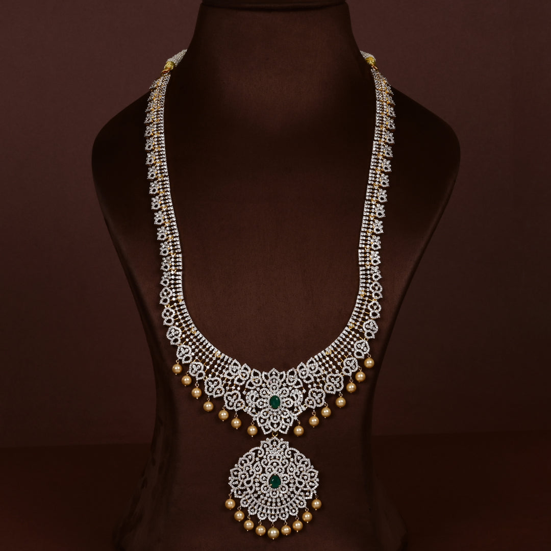 Luxury diamond-look silver cz emerald necklace with premium cz stones and semi-precious emerald stone in 92.5 silver, bridal wedding jewellery with gold finish by Sri Fine Jewellery Punjagutta Hyderabad.