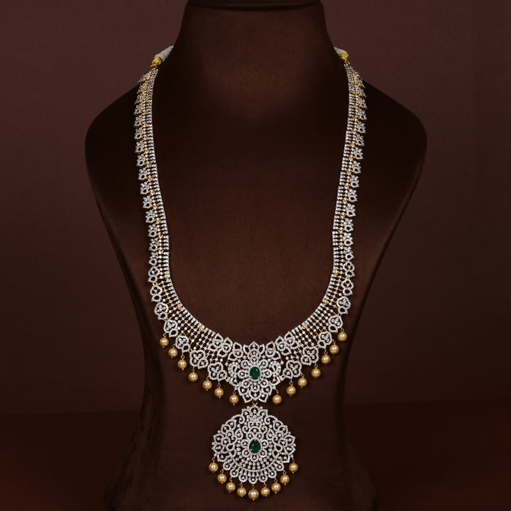 Luxury diamond-look silver cz emerald necklace with premium cz stones and semi-precious emerald stone in 92.5 silver, bridal wedding jewellery with gold finish by Sri Fine Jewellery Punjagutta Hyderabad.