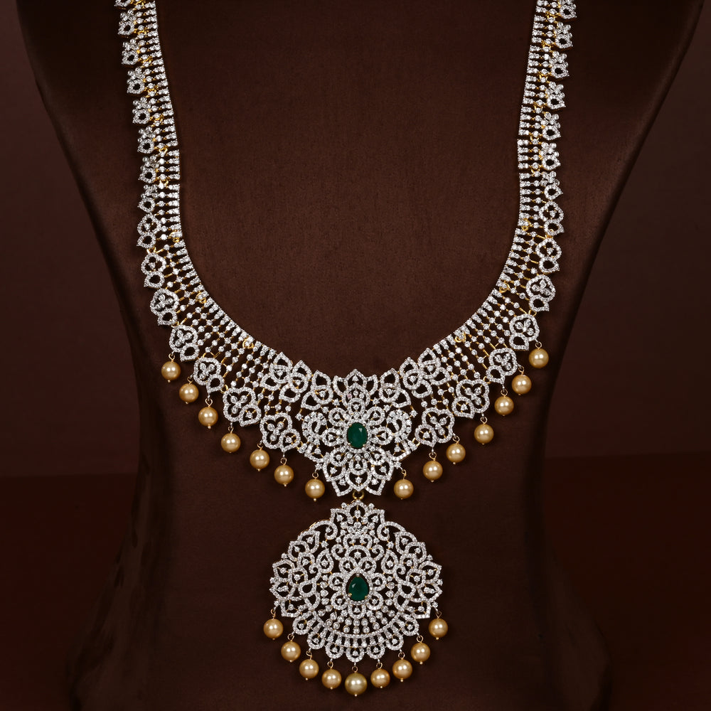 Luxury diamond-look silver cz emerald necklace with premium cz stones, semi-precious emerald stone and  pearl drops in 92.5 silver, bridal wedding jewellery with gold finish by Sri Fine Jewellery Punjagutta Hyderabad.