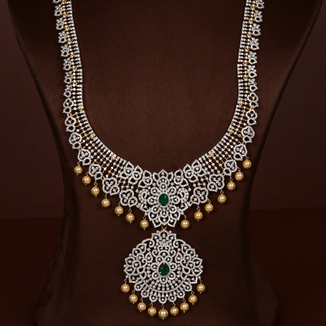 Luxury diamond-look silver cz emerald necklace with premium cz stones, semi-precious emerald stone and  pearl drops in 92.5 silver, bridal wedding jewellery with gold finish by Sri Fine Jewellery Punjagutta Hyderabad.