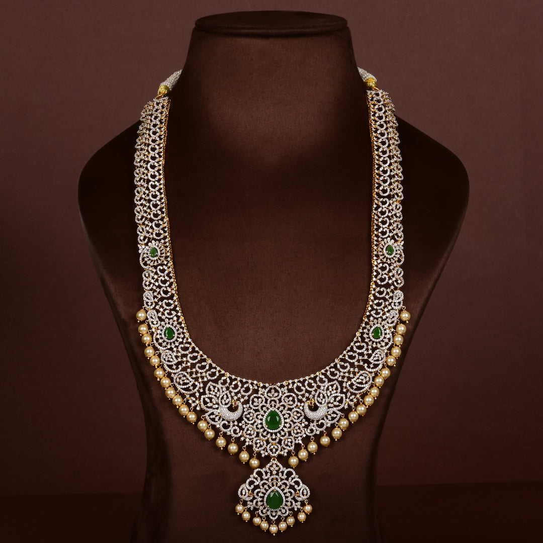 Luxury diamond-look silver cz emerald necklace with premium cz stones, semi-precious emerald stone and  pearl drops in 92.5 silver, bridal wedding jewellery with gold finish by Sri Fine Jewellery Punjagutta Hyderabad.