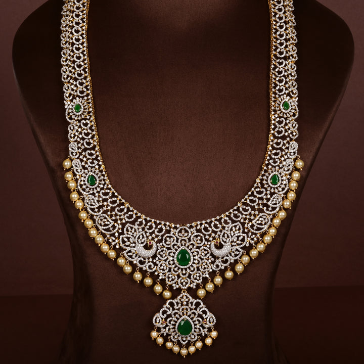 Luxury diamond-look silver cz emerald necklace with premium cz stones, semi-precious emerald stone and  pearl drops in 92.5 silver, bridal wedding jewellery with gold finish by Sri Fine Jewellery Punjagutta Hyderabad.