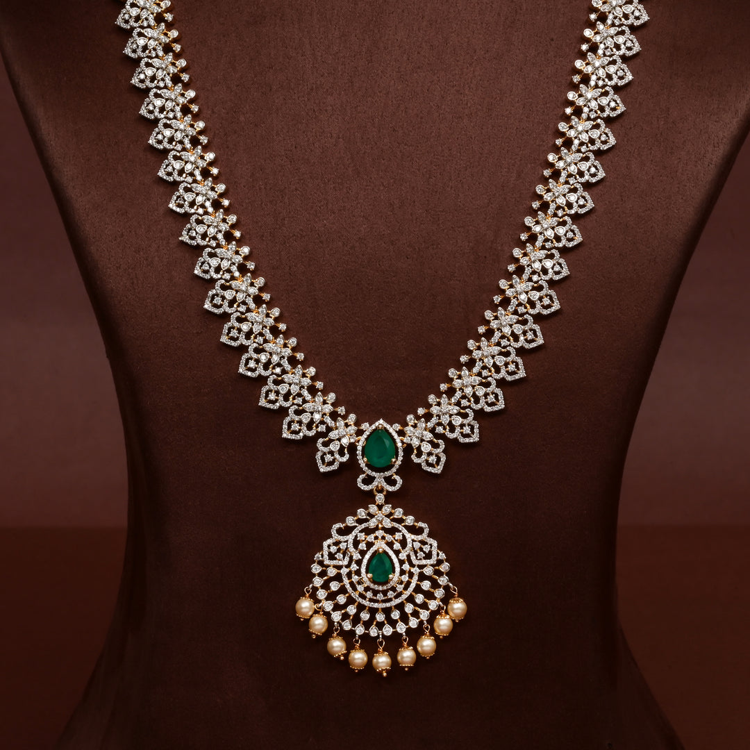 Close-up of Hriday collection of  92.5 silver Victorian-style long necklace with CZ stones, intricate floral motifs, and pendant design for bridal and festive wear by Sri Fine Jewellery, Hyderabad.