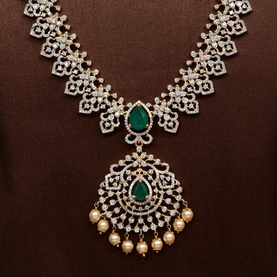 Close-up of Hriday collection of  92.5 silver Victorian-style long necklace with CZ stones, intricate floral motifs, and pendant design for bridal and festive wear by Sri Fine Jewellery, Hyderabad.